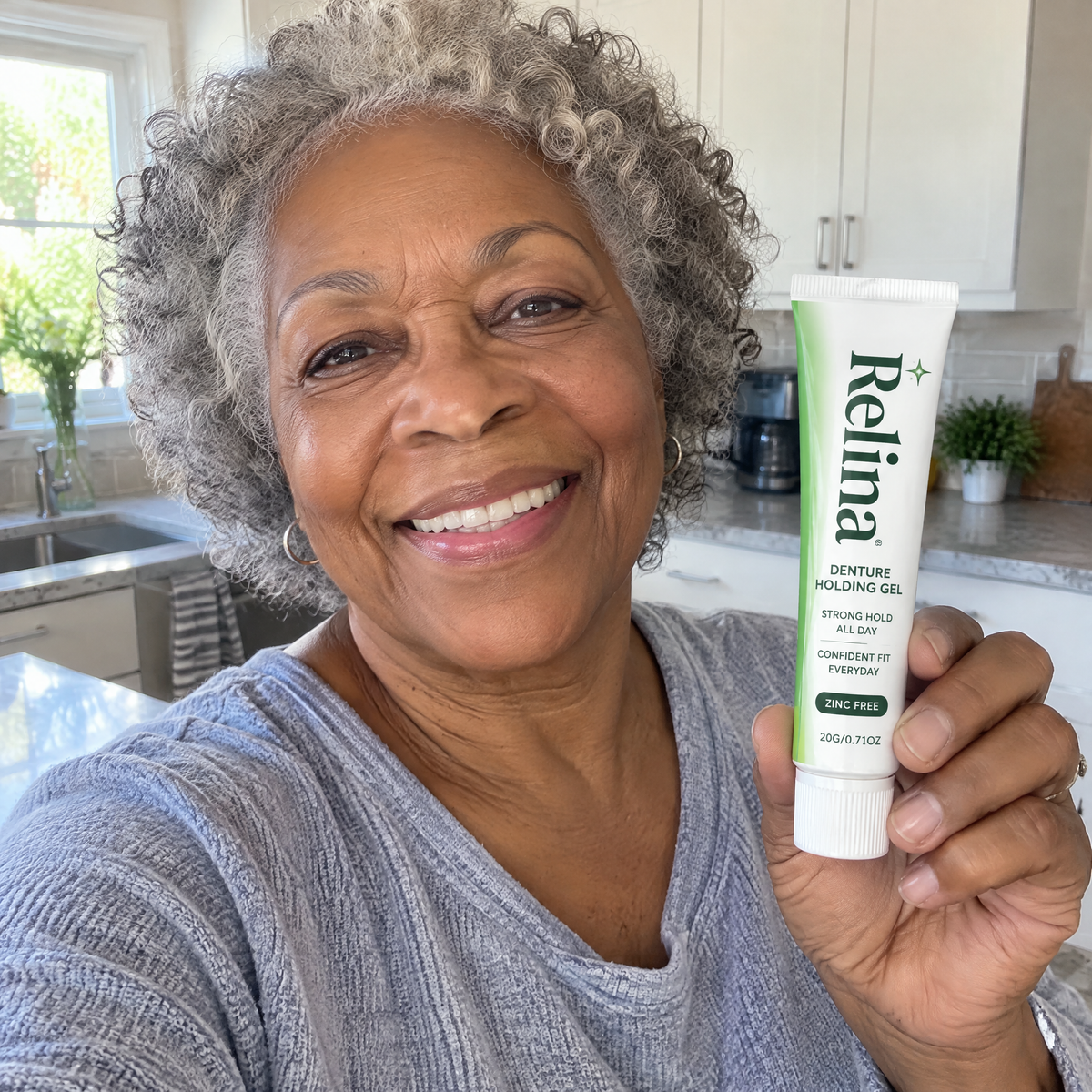 Linda K. holding Relina tube in kitchen