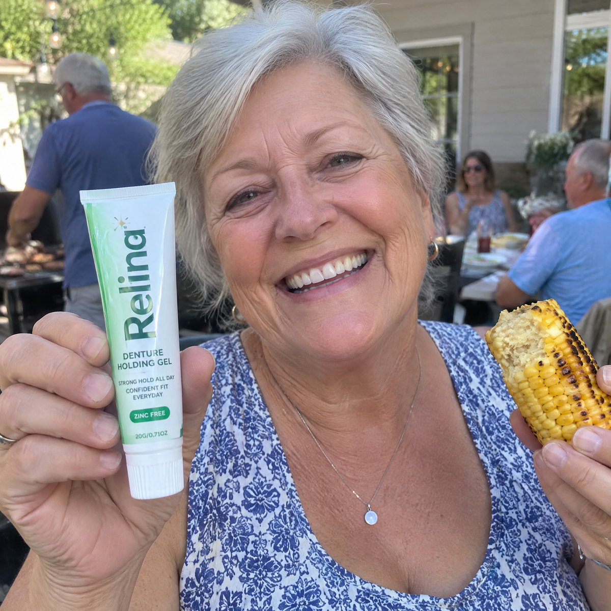 Margaret T. holding Relina tube at BBQ